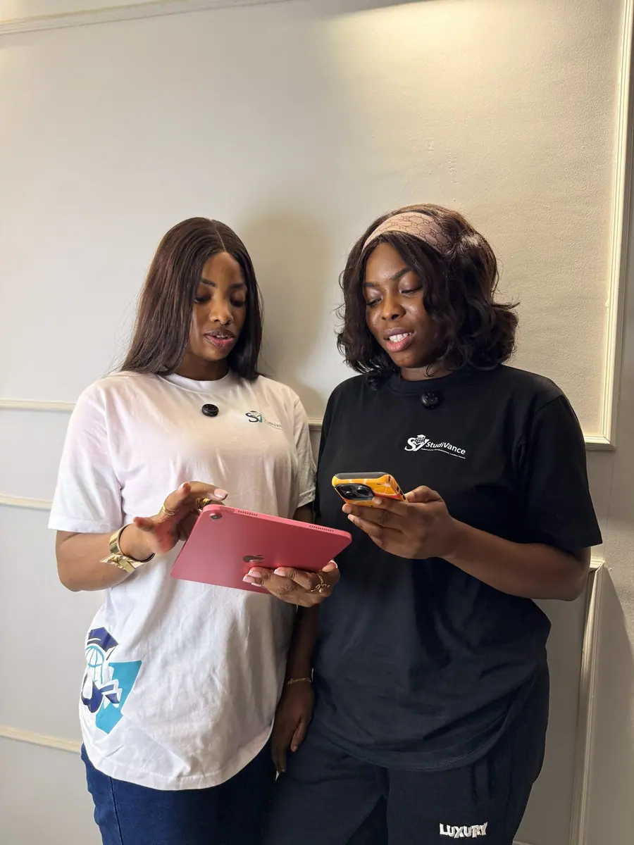 Studivance team reviewing academic work on a tablet
